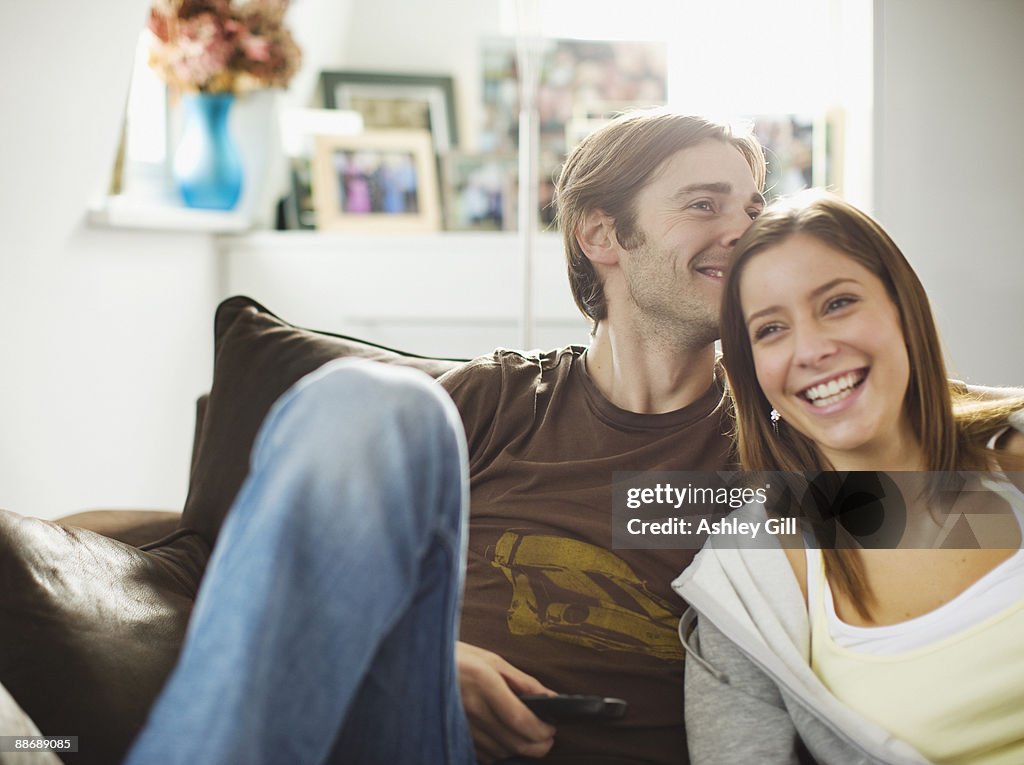 Couple sitting on sofa