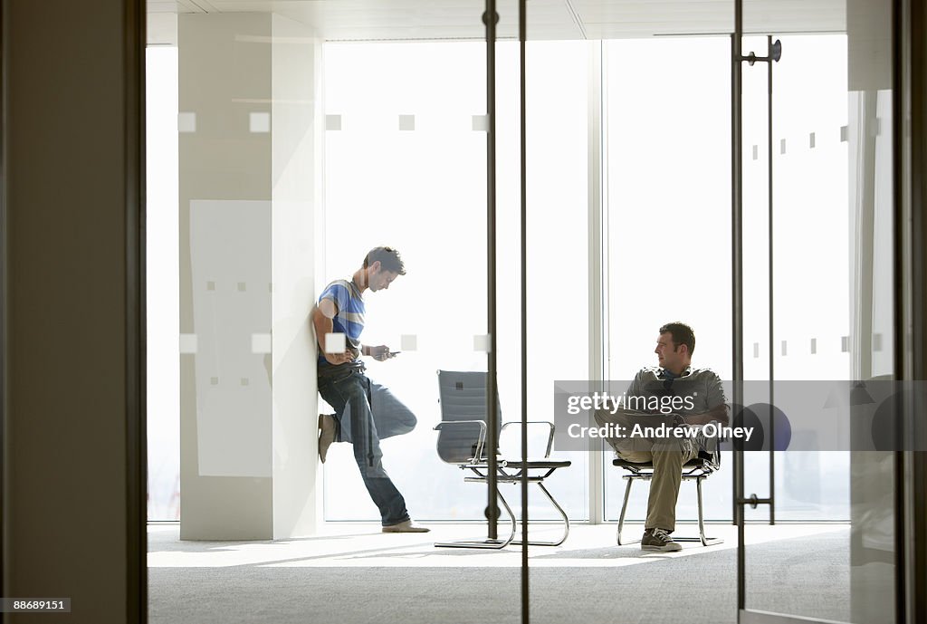 Businessmen having meeting in empty office