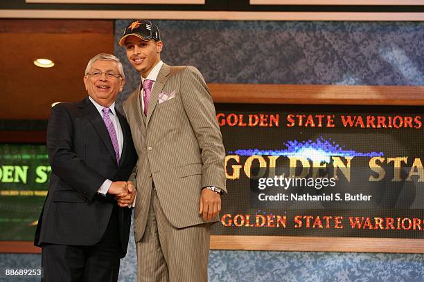 Stephen Curry shakes hands with NBA Commissioner David Stern after being selected seventh by the Golden State Warriors during the 2009 NBA Draft on...