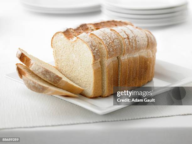 close up of fresh sliced loaf of bread - loaf of bread foto e immagini stock