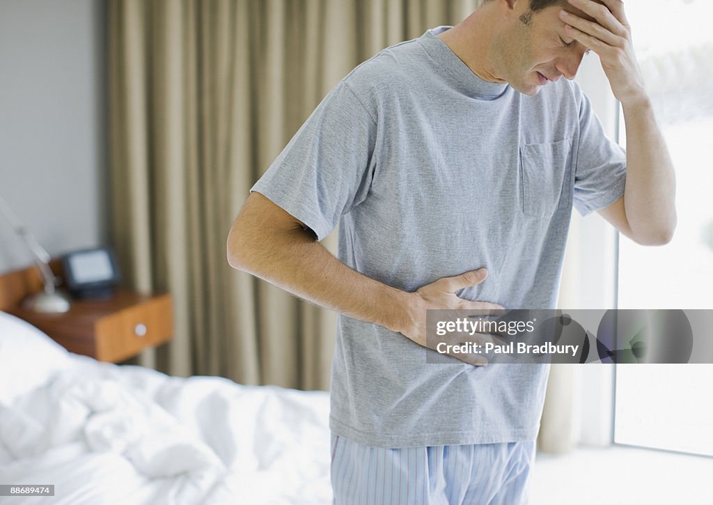 Man with stomachache and headache