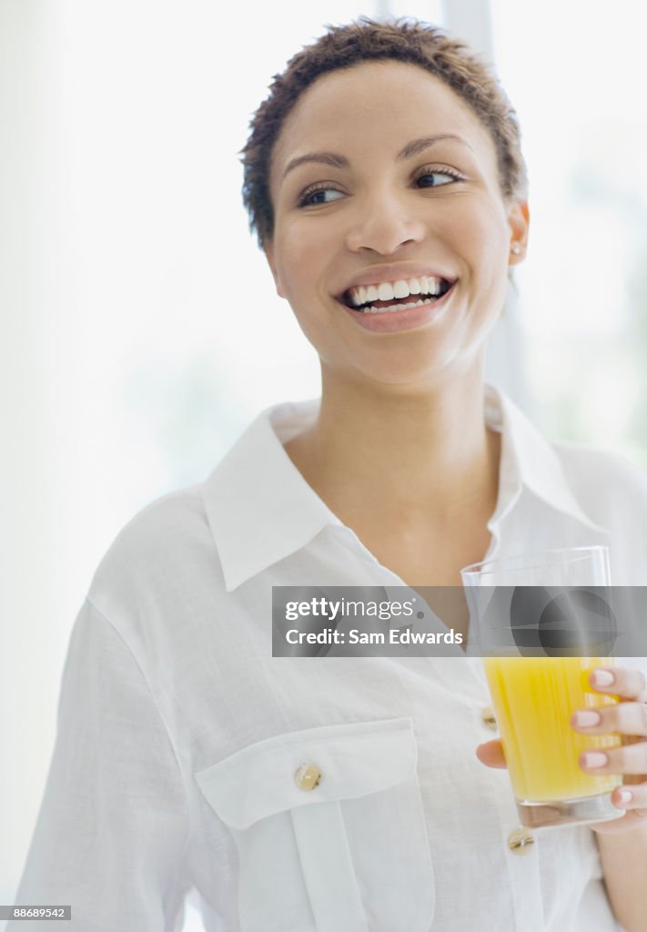 Woman drinking orange juice