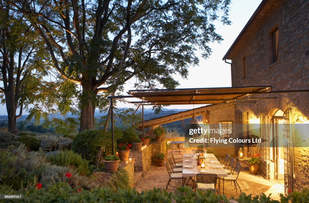 Elegant table set on patio, Umbria, Italy