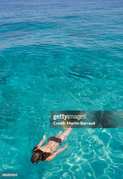 girl snorkeling in ocean - スキアトス島 ストックフォトと画像