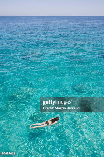 girl swimming in ocean - スキアトス島 ストックフォトと画像