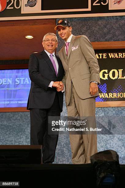Stephen Curry shakes hands with NBA Commissioner David Stern after being selected seventh by the Golden State Warriors during the 2009 NBA Draft on...