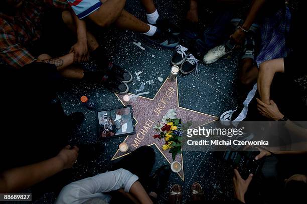 Fans of pop star Michael Jackson mourn his death at talk radio host Michael Jackson's star on the Hollywood Walk of Fame on June 25, 2009 in Los...