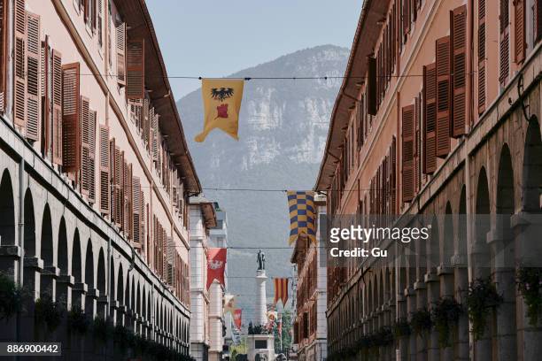 traditional street with flags, chambery, rhone-alpes, france - chambéry ストックフォトと画像