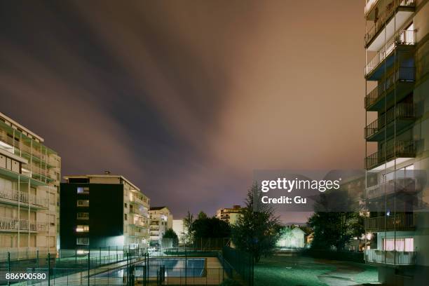 apartment blocks at night, chambery, rhone-alpes, france - chambéry foto e immagini stock