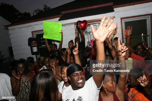 People gather outside the former childhood home of Pop Star Michael Jackson on June 25, 2009 in Gary, Indiana. Jackson the iconic pop star, died...