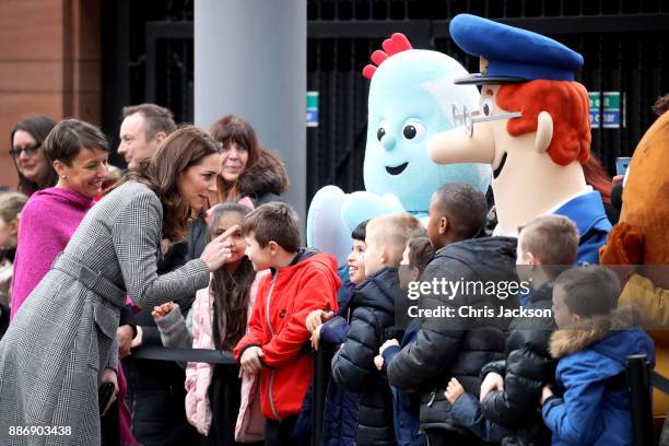 Catherine, Duchess of Cambridge talks to children as she attends a 'Stepping Out' session at Media City on December 6, 2017 in Manchester, England....