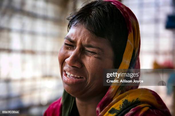 Dildar Begum becomes emotional while talking on December 3, 2017 in Cox's Bazar, Bangladesh. She fled to Bangladesh shortly after the August 25th...