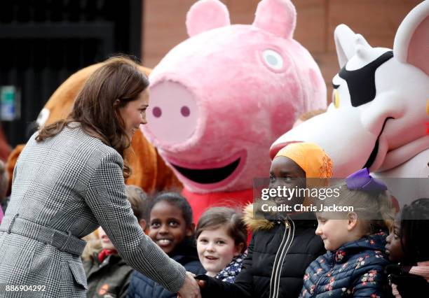 Catherine, Duchess of Cambridge talks to children as she attends a 'Stepping Out' session at Media City on December 6, 2017 in Manchester, England....