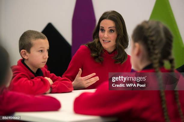 Catherine, Duchess of Cambridge speaks to children as she meets school children during a 'Stepping Out' session at MediaCityUK on December 6, 2017 in...