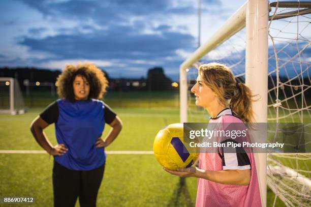 womens football team practice, hackney, east london, uk - girl goalie stock pictures, royalty-free photos & images