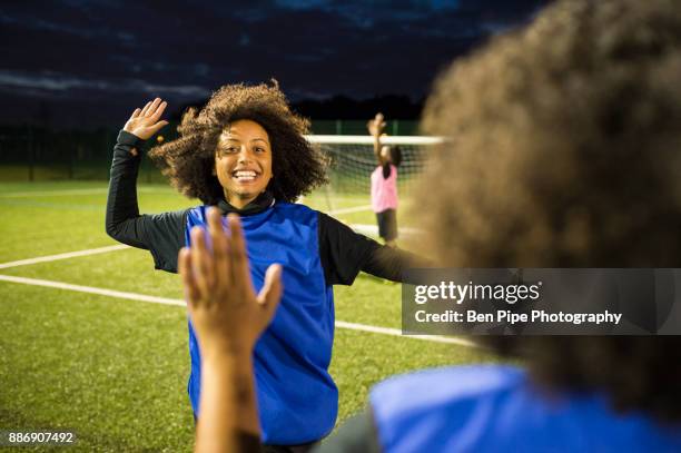 female football players jubilant, hackney, east london, uk - soccer close up stockfoto's en -beelden