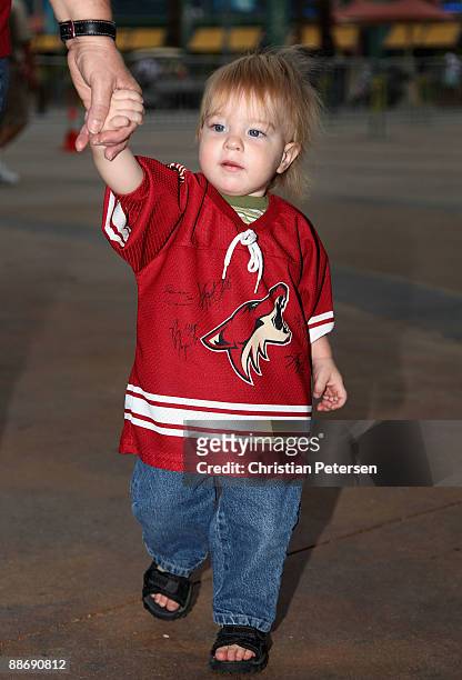 Young fan of the Phoenix Coyotes arrives to the open house at Jobing.com Arena on June 25, 2009 in Glendale, Arizona.