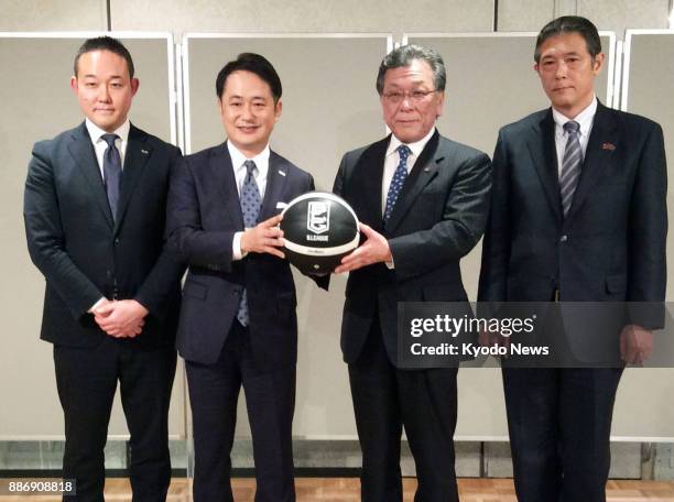 Executives of Toshiba Corp. And DeNA Co., pose during a press conference in Tokyo on Dec. 6 as Toshiba announces the sale of its professional...