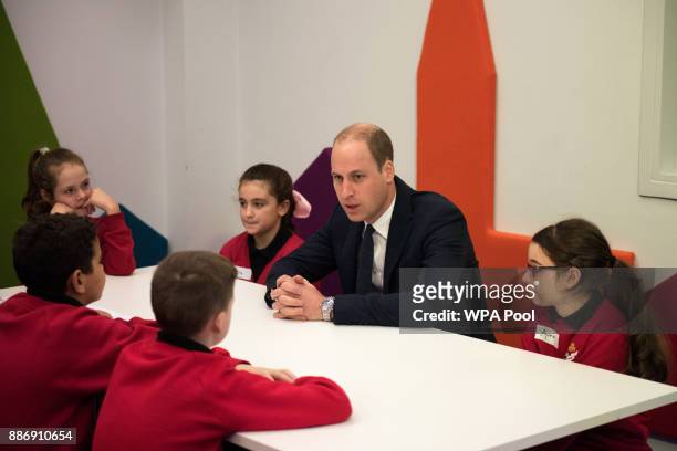 Prince William, Duke of Cambridge speaks to children as she meets school children during a 'Stepping Out' session at MediaCityUK on December 6, 2017...
