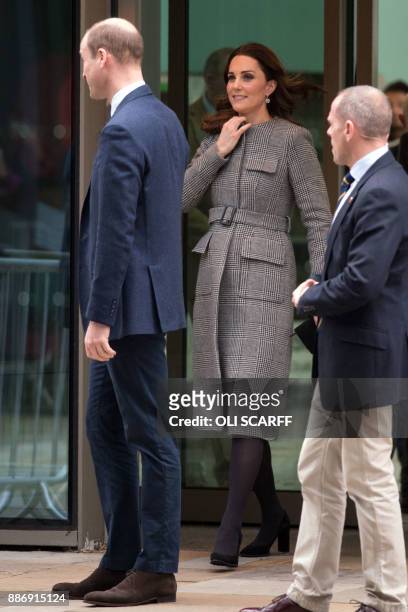 Britain's Prince William, Duke of Cambridge , and his wife Britain's Catherine, Duchess of Cambridge leave after speaking to school children taking...