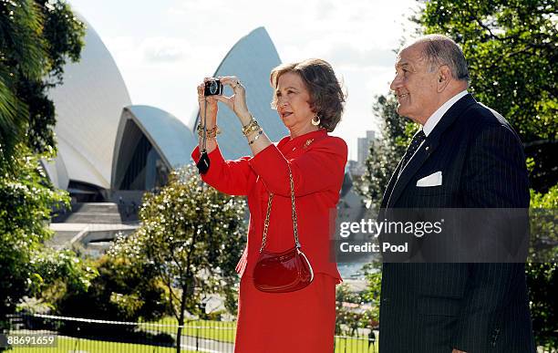 Queen Sophia of Spain with Sir Nicholas Shehadie , the husband of the Governor of New South Wales Marie Bashir, takes a photograph in the grounds of...