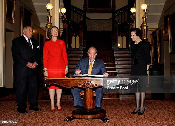 King Juan Carlos I of Spain and Queen Sofia sign the Government House guest book as the NSW Governor Professor Marie Bashir and her husband Sir...