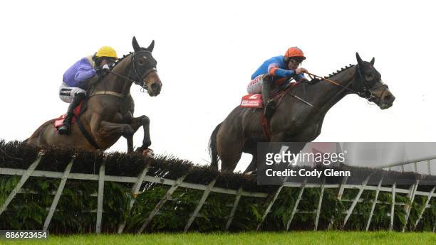 Fairyhouse , Ireland - 3 December 2017; Cilaos Emery, with Patrick Mullins up, left, jump the last alongside Mick Jazz, with Davy Russell up, during...