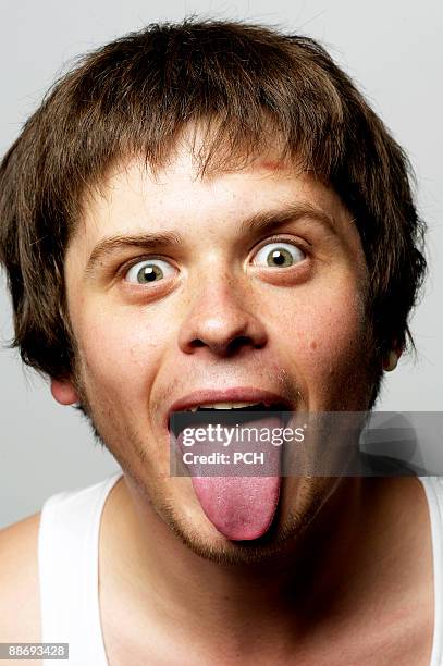 Young Man Sticking His Tongue Out, Bildbanksbilder