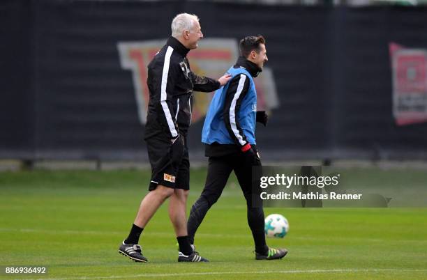 Trainer Andre Hofschneider and Steven Skrzybski of 1 FC Union Berlin during the 1 FC Union Berlin training on December 6, 2017 in Berlin, Germany.