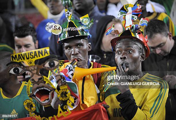 Supporters of the Bafana Bafana, the South African football team, play the vuvuzela, large coloured plastic trumpet, in the stands before the Fifa...