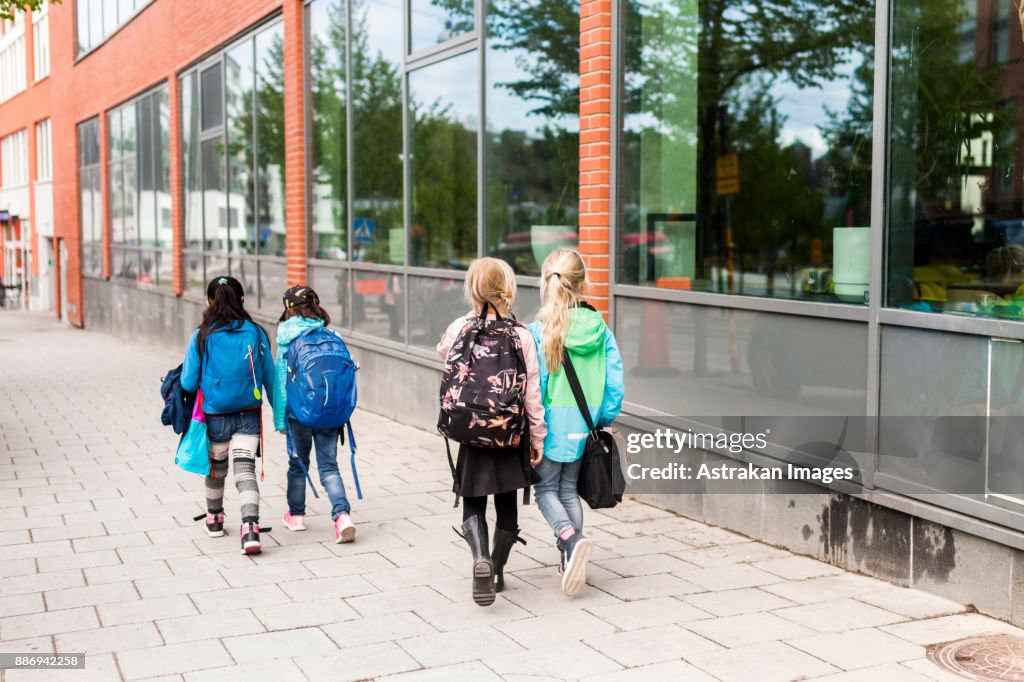 Girls (8-9) coming back from school together