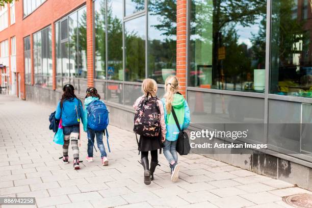girls (8-9) coming back from school together - endast flickor bildbanksfoton och bilder