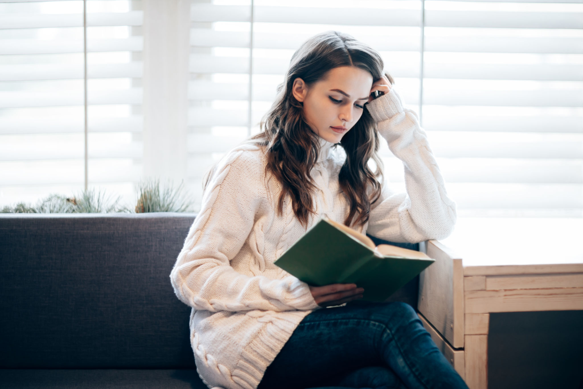 Young beautiful woman reading book at home Young beautiful woman reading book at home