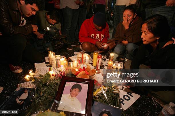 Fans mourn the death of Michael Jackson at the pop icon's Star on the Walk of Fame June 25, 2009 in Los Angeles California. Jackson died after...