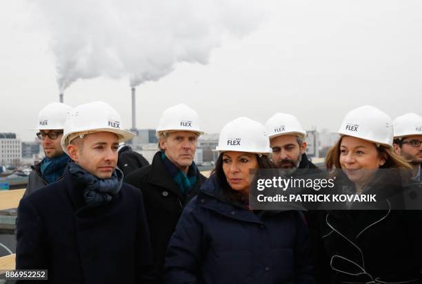 Paris mayor Anne Hidalgo , deputy-mayor in charge of housing Ian Brossat and mayor of Paris' 12th arrondissement Catherine Baratti-Elbaz visit a new...