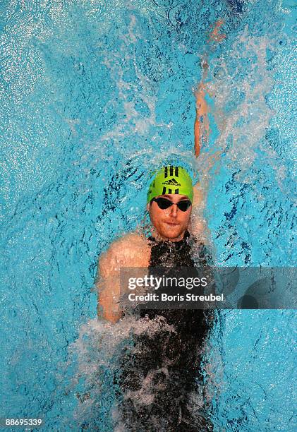 Helge Meeuw of SG Frankfurt competes in the heats of the men's 200 m backstroke during the German Swimming Championship 2009 at the Eurosportpark on...