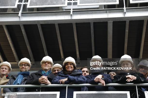 Paris mayor Anne Hidalgo , deputy-mayor in charge of housing Ian Brossat and mayor of Paris' 12th arrondissement Catherine Baratti-Elbaz visit a new...