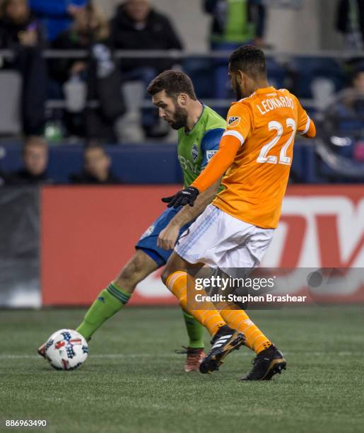 Will Bruin of the Seattle Sounders passes the ball in front of Leonardo of the Houston Dynamo during the second leg of the MLS Western Conference...