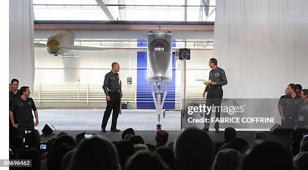 Swiss scientist-adventurer and pilot Bertrand Piccard and Solar Impulse CEO Andre Borschberg pose with Prince Albert II of Monaco unveil the 'Solar...