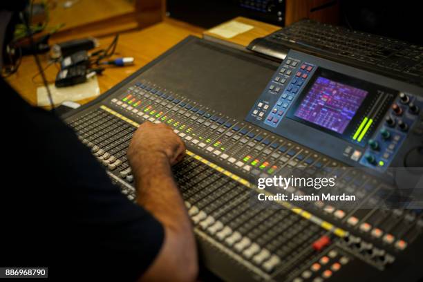 professional sound and video engineer working in digital recording, broadcasting, editing tv studio - backstage tv stock pictures, royalty-free photos & images