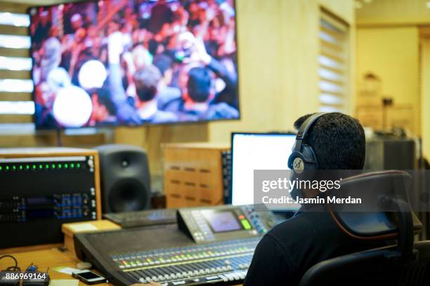 tv editor working with vision mixer in television broadcast gallery - editing room stock pictures, royalty-free photos & images