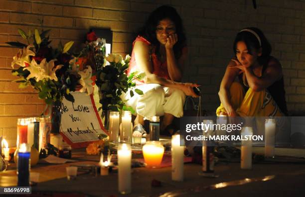 Fan Blanca Arias and Alba Albrec during a candlelight vigil held outside the UCLA Medical Center on June 26, 2009 after the death of music legend...