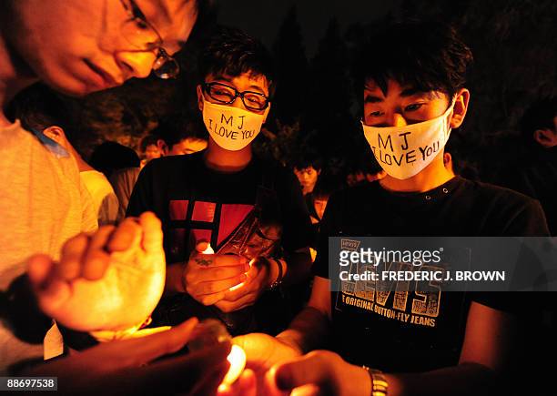 Young Chinese mourn the death of Michael Jackson in Beijing on June 26, 2009. The death of Michael Jackson gripped China on June 26, as fans spoke of...