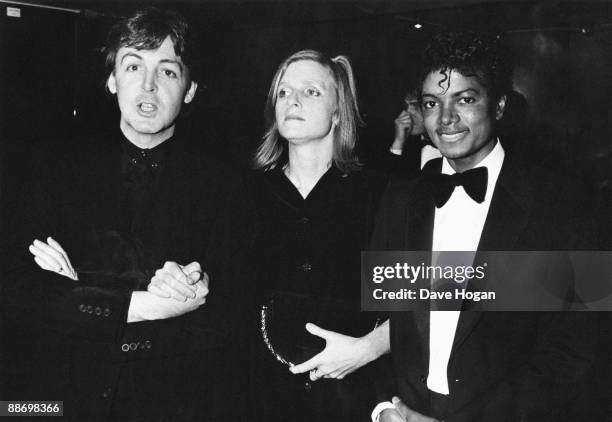 From left to right, Paul McCartney poses with his wife Linda and Michael Jackson at the British Record Industry Awards in London, 16th February 1983....