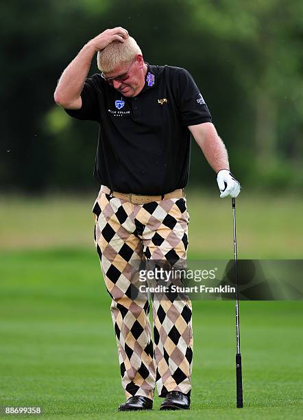 John Daly of USA reacts to his approach shot on the 14th hole during the second round of The BMW International Open Golf at The Munich North...