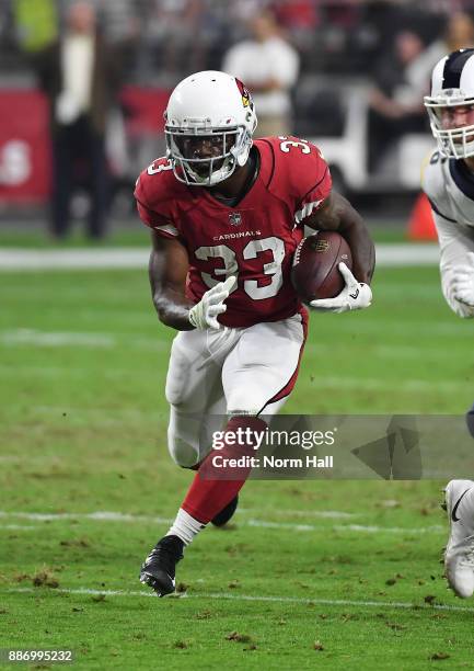 Kerwynn Williams of the Arizona Cardinals runs with the ball against the Los Angeles Rams at University of Phoenix Stadium on December 3, 2017 in...
