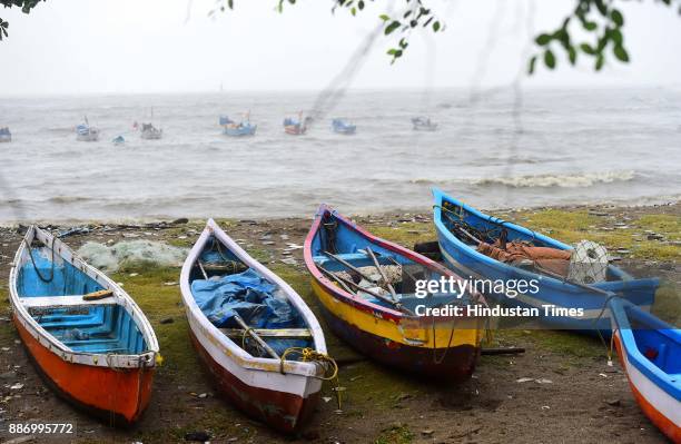 Boats lay next to Arabian Sea at Carter Road, Khar as Mumbai experiences high tide due to side effect of Cyclone Ockhi, on December 5, 2017 in...