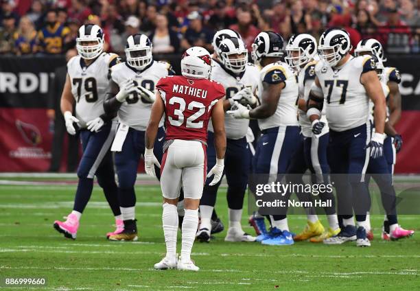 Tyrann Mathieu of the Arizona Cardinals looks at the the Los Angeles Rams as they break out of a huddle at University of Phoenix Stadium on December...