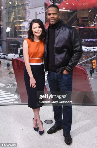 Actress Miranda Cosgrove visits "Extra" with A.J. Calloway at H&M Times Square on December 6, 2017 in New York City.