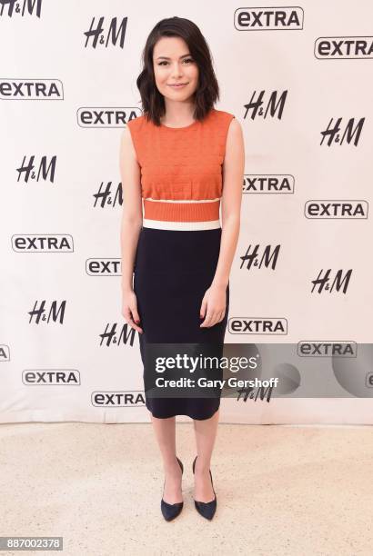 Actress Miranda Cosgrove visits "Extra" at H&M Times Square on December 6, 2017 in New York City.